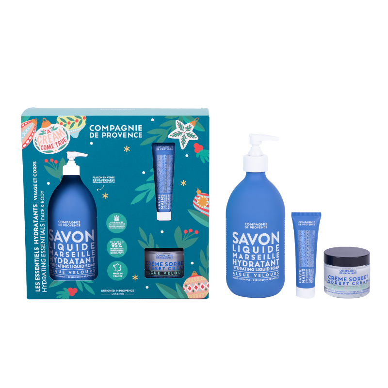 SEAWEED-ULTRA-HYDRATING-ESSENTIALS-2023 Ein Set aus Seife, Handcreme und Gesichtscreme von Compagnie de Provence, verpackt in einer festlichen Geschenkbox.