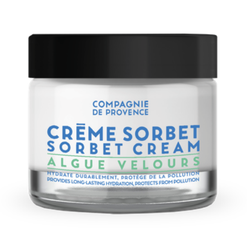 Ein Glasbehälter mit schwarzem Deckel, gefüllt mit 'Crème Sorbet' von Compagnie de Provence.