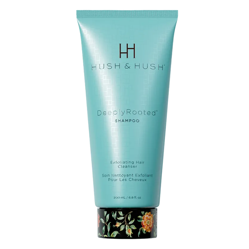 HUSH & HUSH DeeplyRooted Shampoo, 200 ml, exfolierendes Haarreinigungsmittel in türkisfarbener Tube mit floralem Design am Boden.