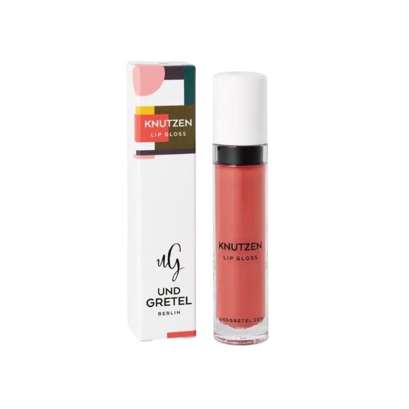 UND GRETEL KNUTZEN Lip Gloss 01 Matte Apricot, Verpackung und Flasche, auf weißem Hintergrund.
