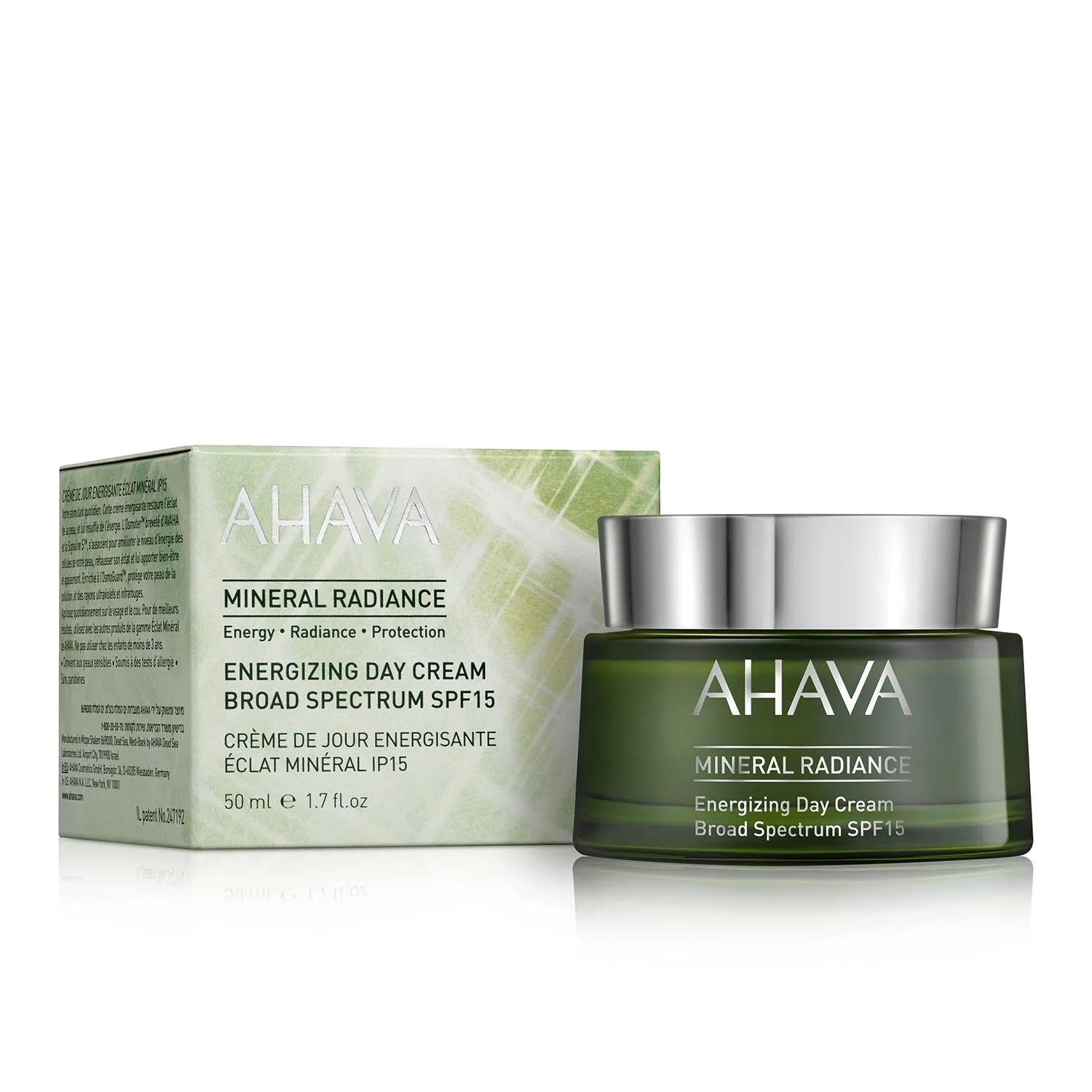 AHAVA Mineral Radiance Energizing Day Cream SPF15, 50 ml, in grünem Tiegel neben der Verpackung.