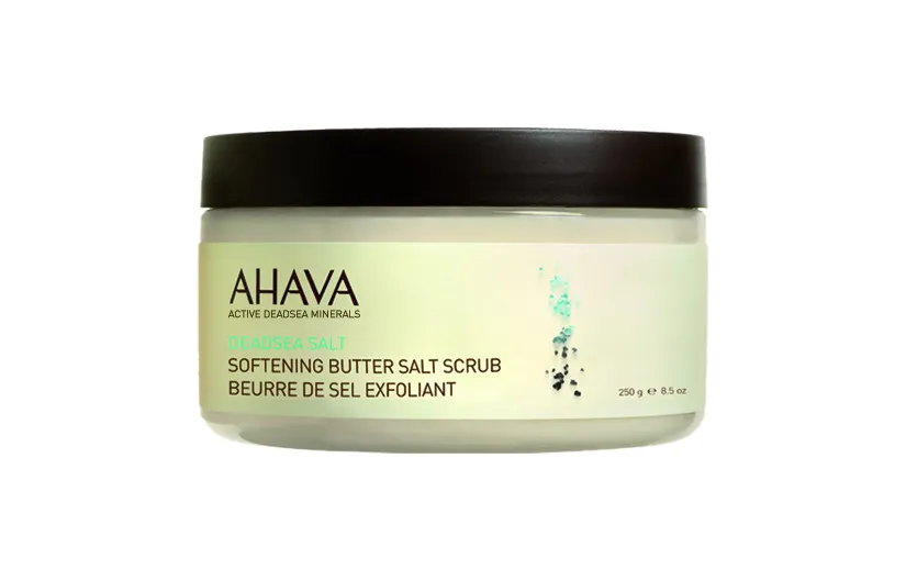AHAVA Dead Sea Salt Softening Butter Salt Scrub in weißem Behälter mit schwarzem Deckel, 250g.