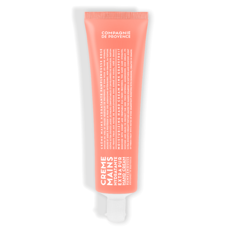 HAND-CREAM-100ML-PINK-GRAPEFRUIT Rosa Handcreme-Tube mit weißer Aufschrift 'Creme Mains Extra Pur' und 'Compagnie de Provence'.