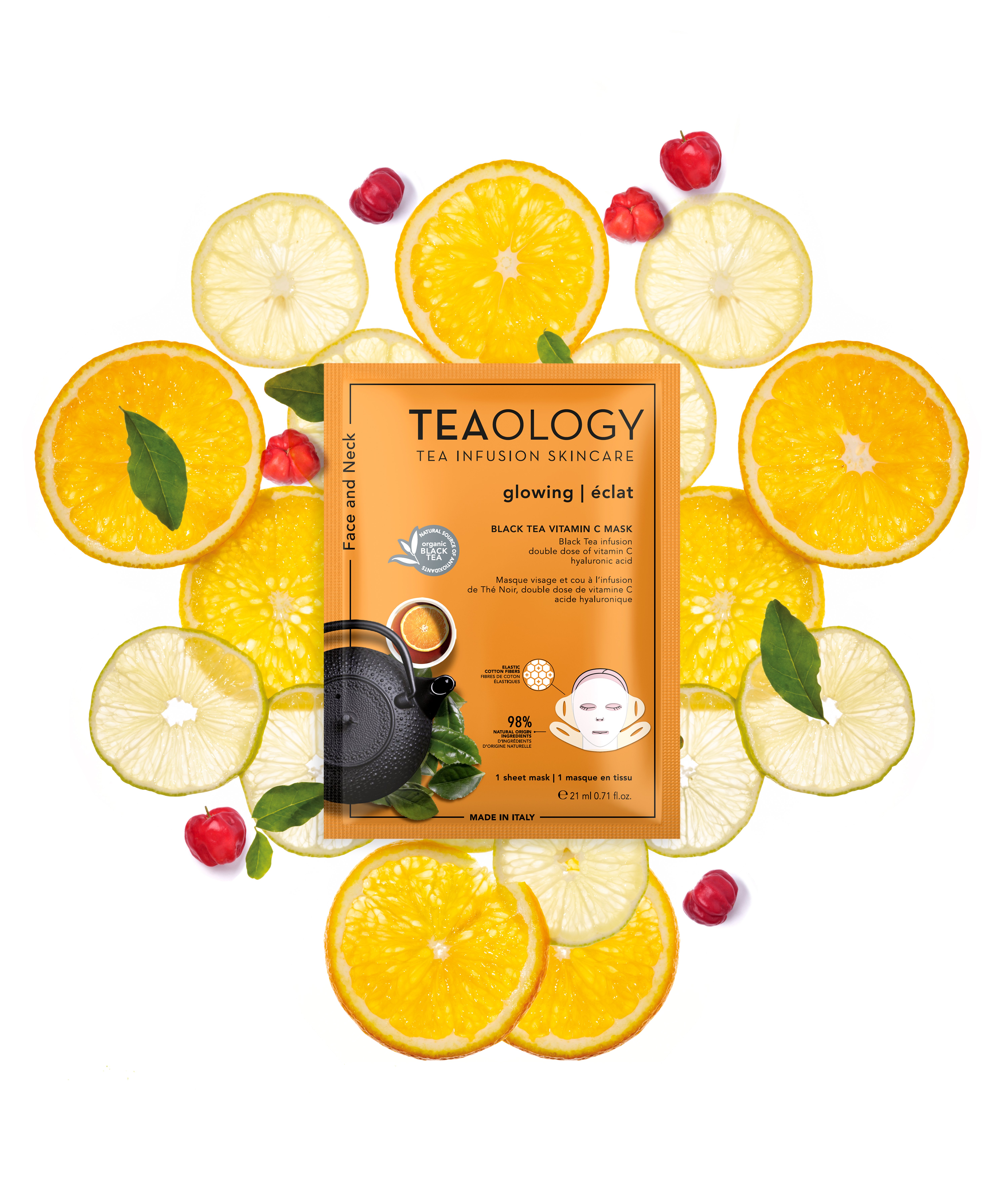 TEAOLOGY Vitamin C Maske, umgeben von Zitronen- und Orangenscheiben sowie Hagebutten.