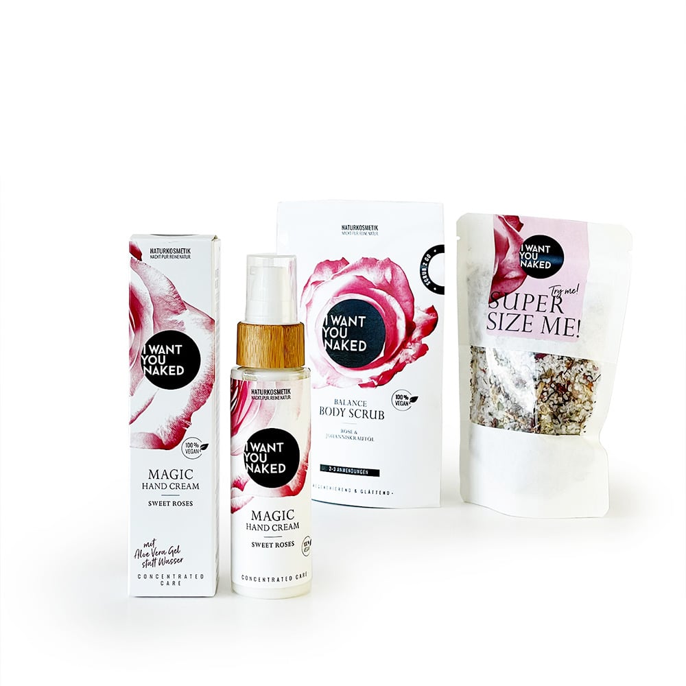 Produkte von 'I Want You Naked': Handcreme, Körperspray und Körperpeeling mit Rosenmotiv.