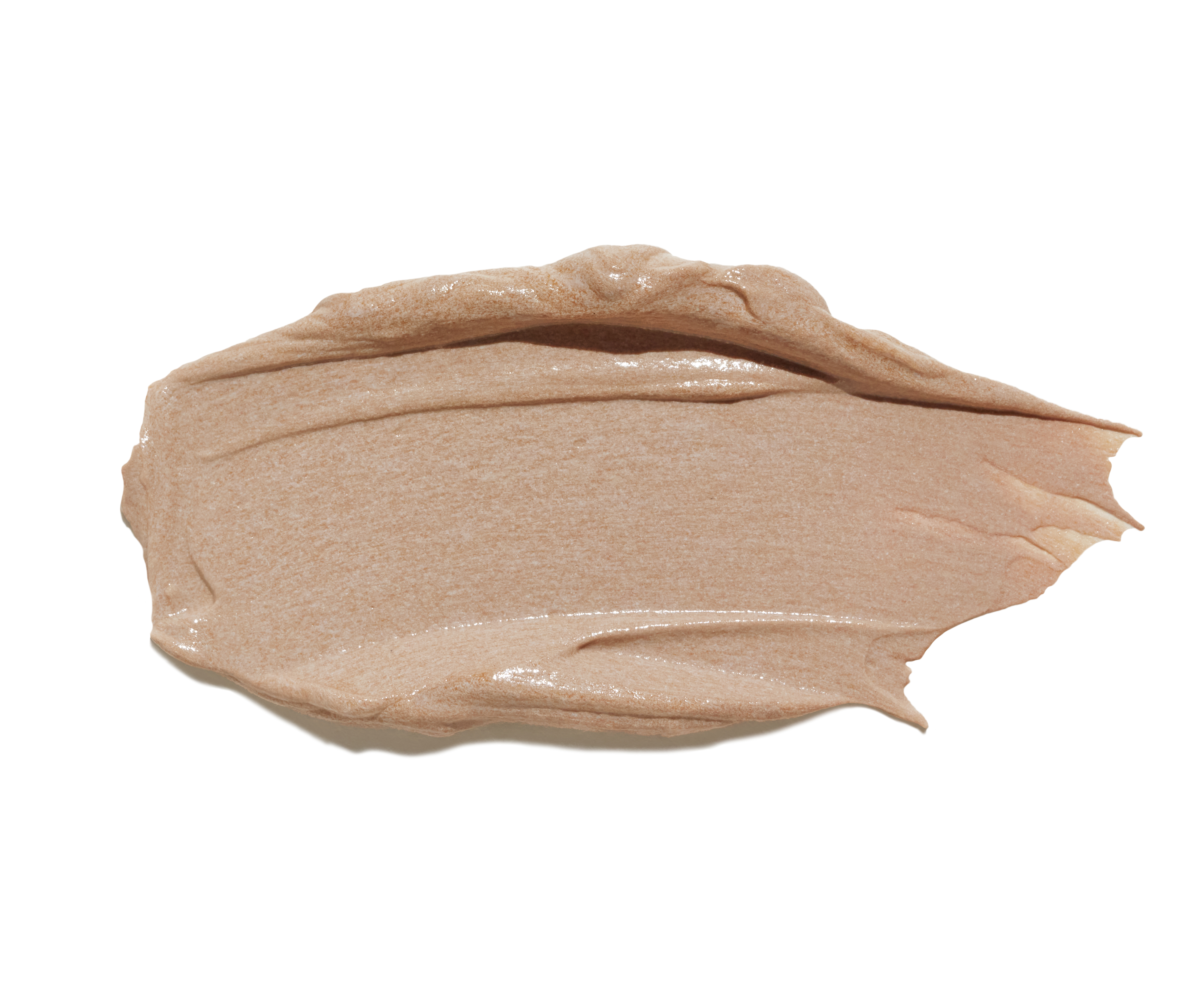 Nahaufnahme einer beigen Creme auf weißem Hintergrund.
