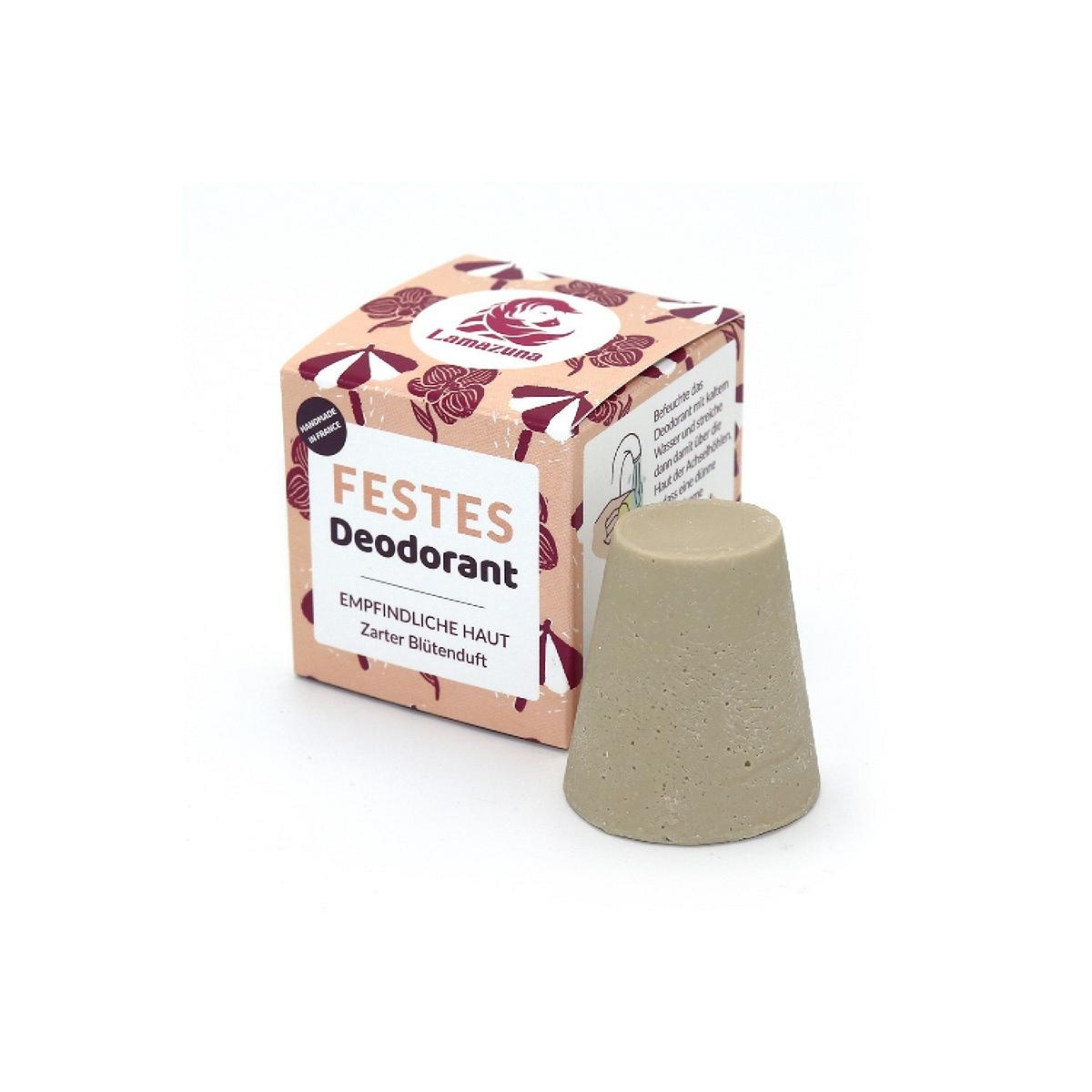 Festes Deodorant für empfindliche Haut mit zartem Blütenduft, neben der Verpackung auf weißem Hintergrund.