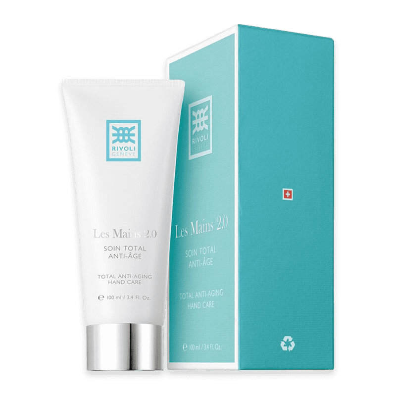 rivoli-geneve-les-mains-2_optimized-0-soin-total-anti-age Rivoli Genève Les Mains 2.0 Soin Total Anti-Aging Handpflege neben Verpackung.